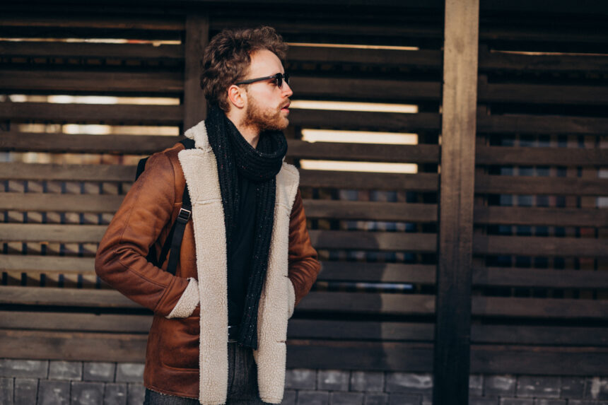 Young handsome man travelling with bag